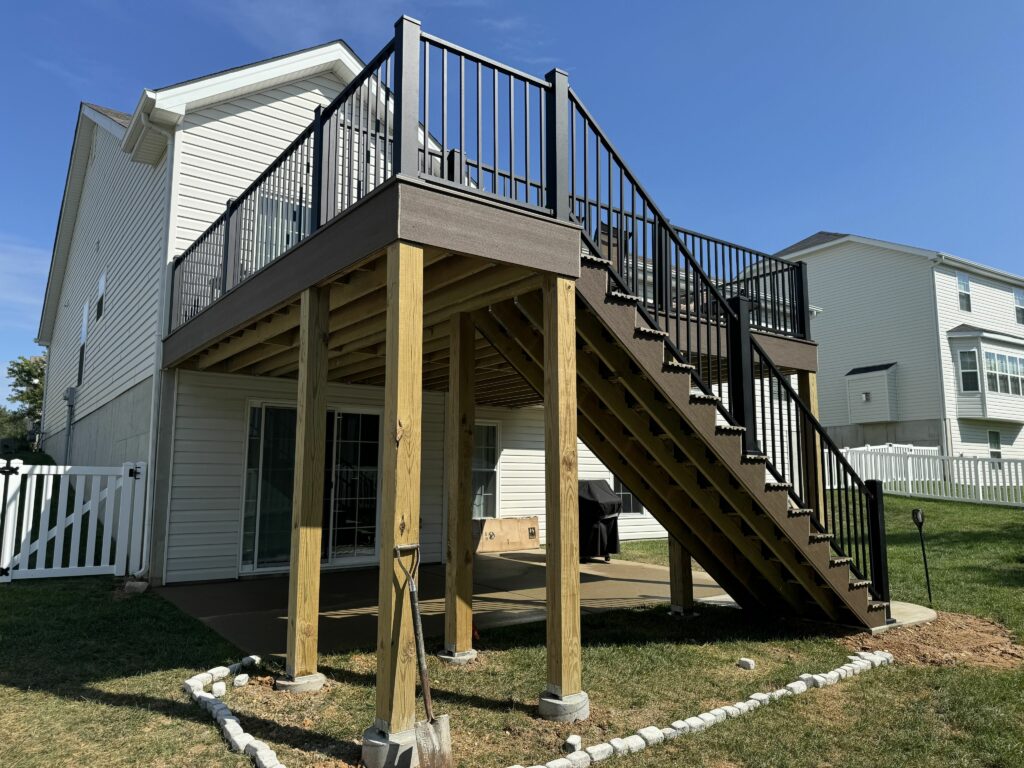 New elevated deck with black railings under construction