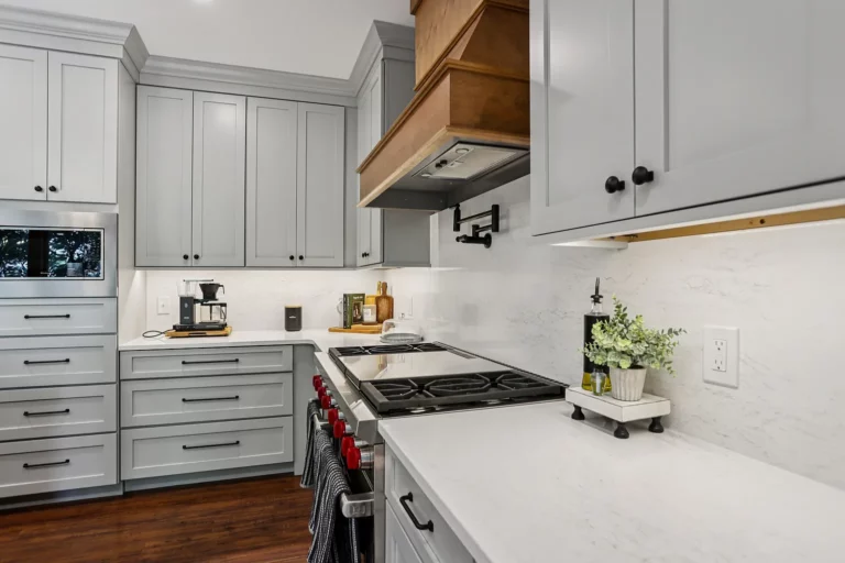 Bright kitchen with white cabinets and quartz countertops